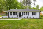 Single-story white brick home